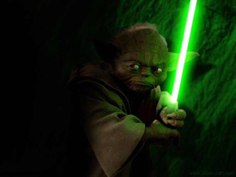 Yoda holding Green Lightsaber